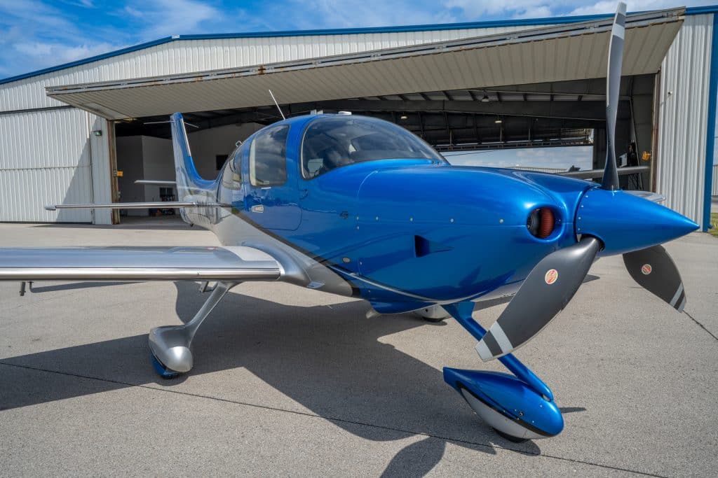 Modern Cirrus airplane on airport ramp
