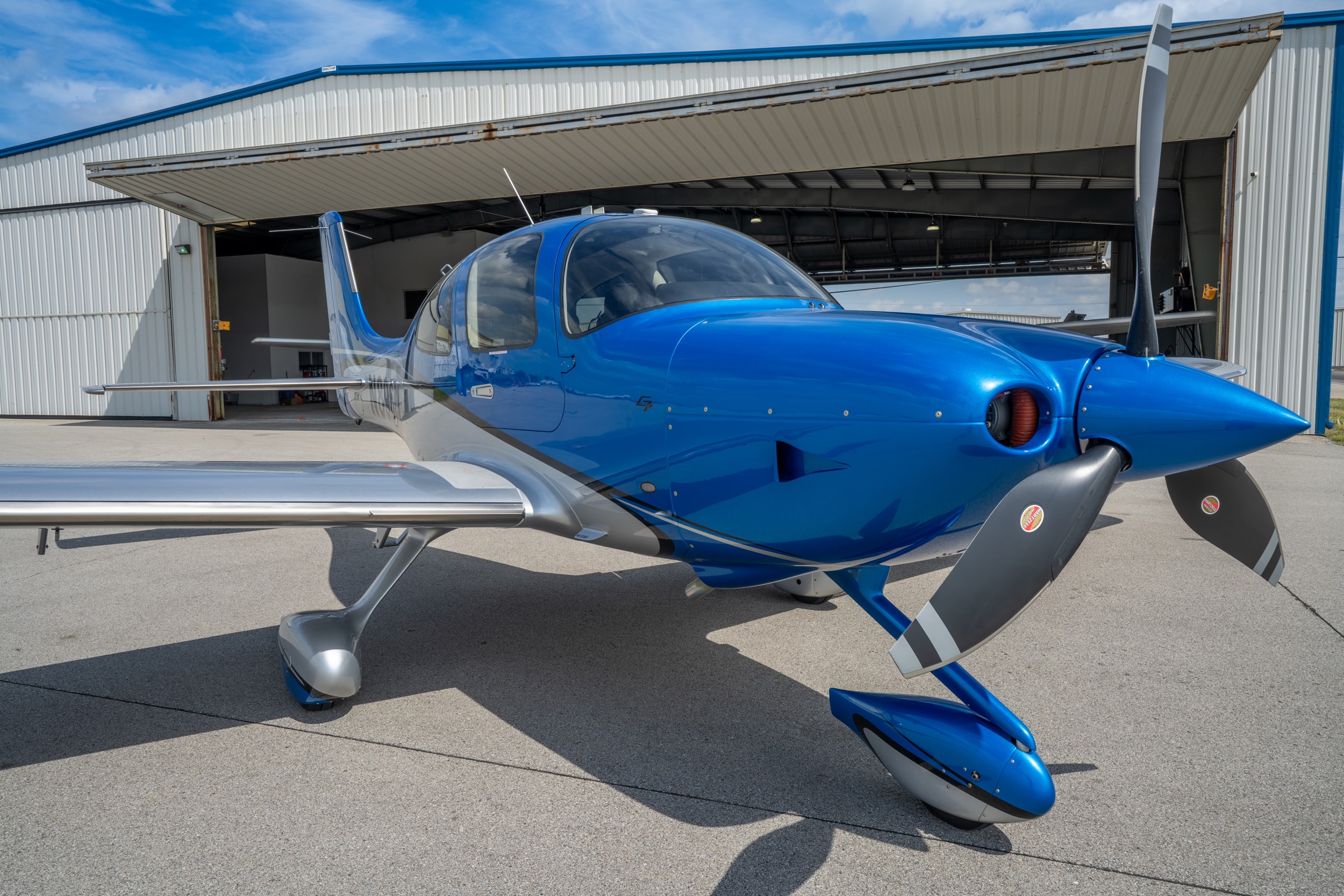 Modern Cirrus airplane on airport ramp
