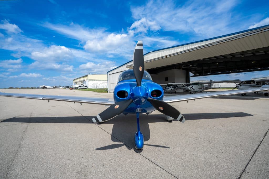 Modern Cirrus airplane on airport ramp
