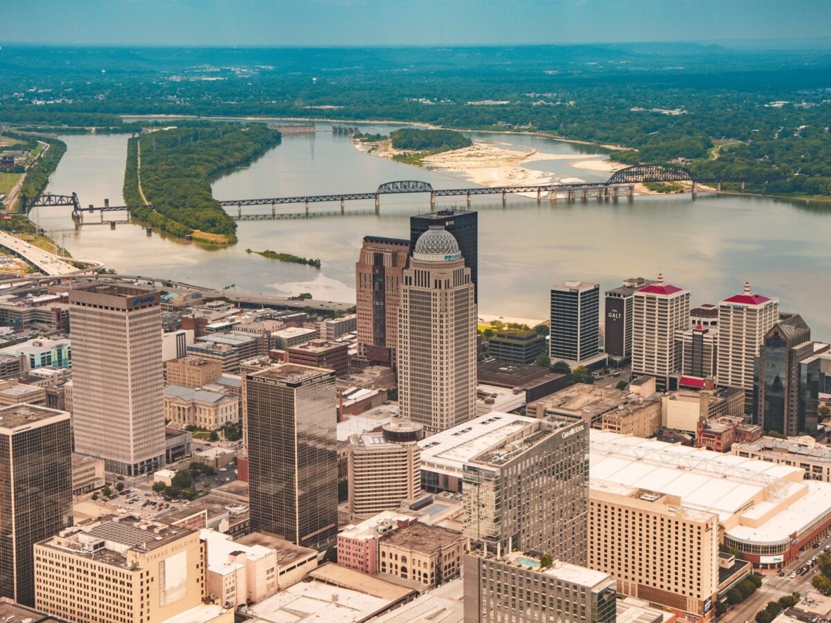 Aerial view over downtown Louisville looking across the towers to the Ohio River and its bridges