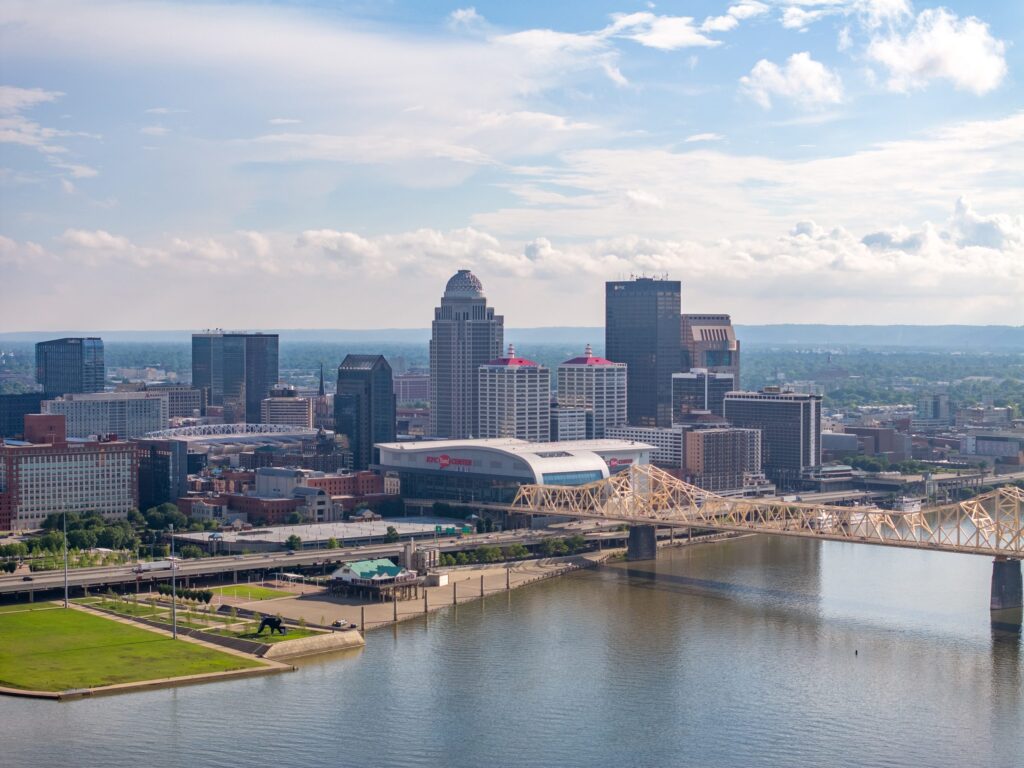 The Louisville skyline and Clark Memorial Bridge seen from across the Ohio River